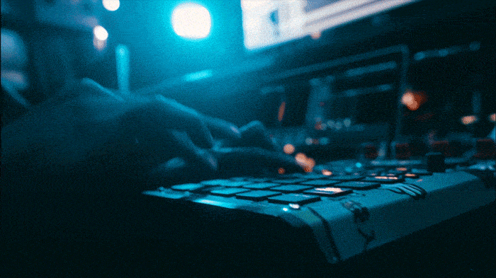 Close up GIF of Dibiase's hand, tapping on the Roland SP-404 MKII.
