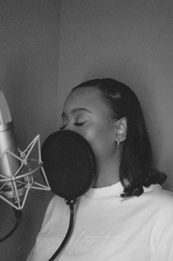 Dana Lu singing in a recording studio